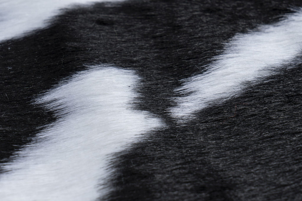 Rodeo 202 — Koeprint · Zachtpolig vloerkleed
